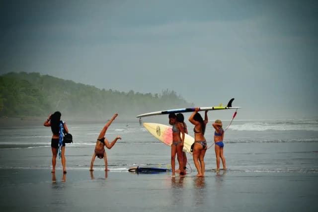 Family enjoying surfing session in Esterillos