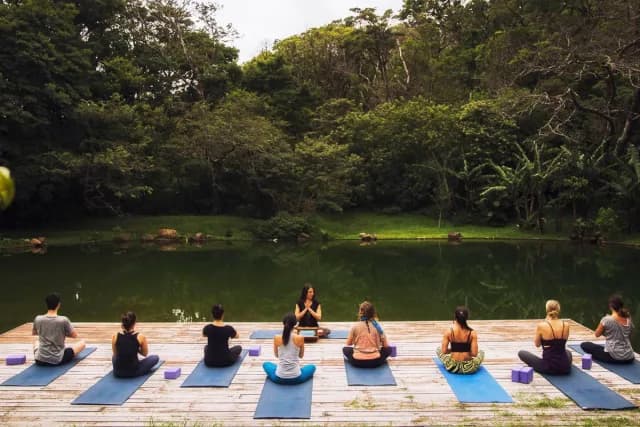 Yoga deck sessions by a lake in Monteverde
