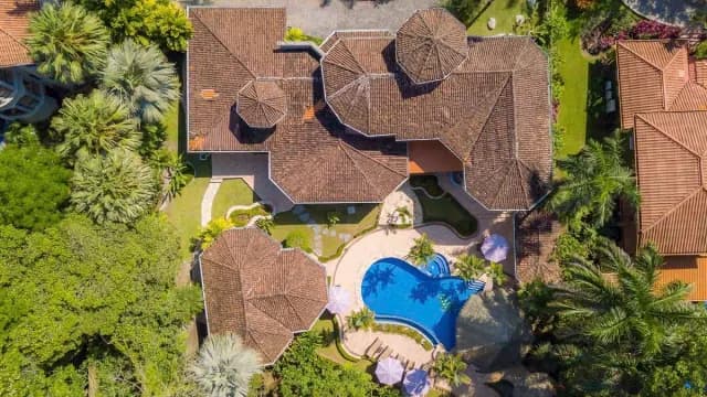 Aerial view of Casa Harmon, including lush gardens and a pool