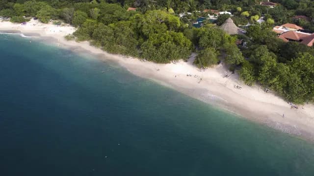 Aerial view of the white sand and blue seas at Conchal Beach, Guanacaste
