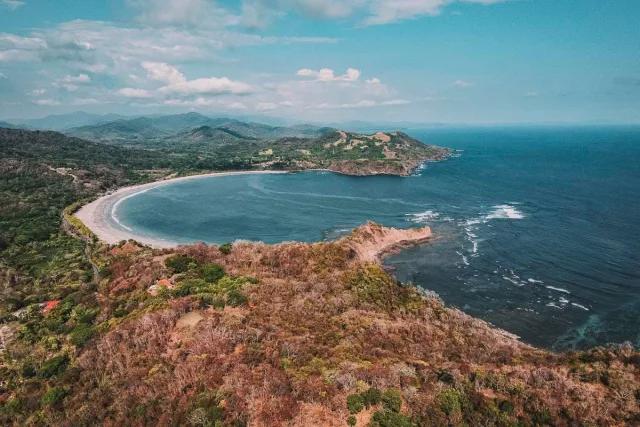 Aerial view of Guanacaste's coastline, covered in dry forest