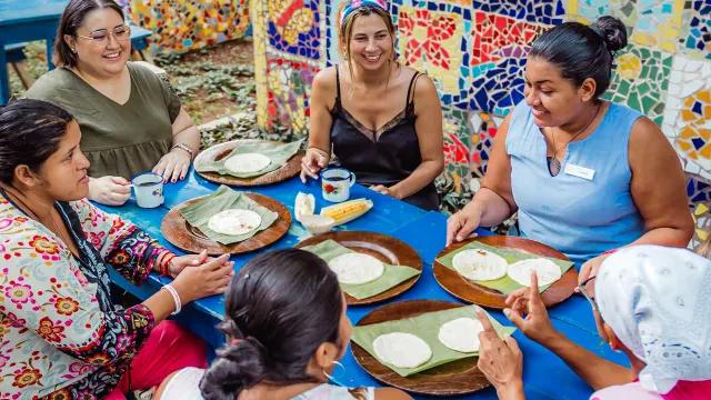 Women discussing community-related issues during a meeting