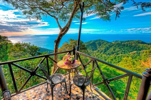 View of the ocean and the lush rainforest from a terrace in the Pacific coastline
