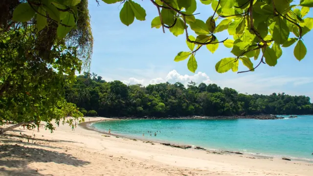 People playing at the beach in Manuel Antonio National Park